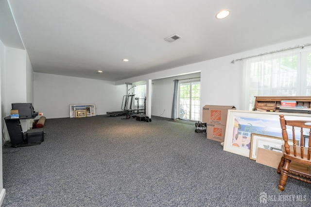 exercise area featuring carpet floors and recessed lighting