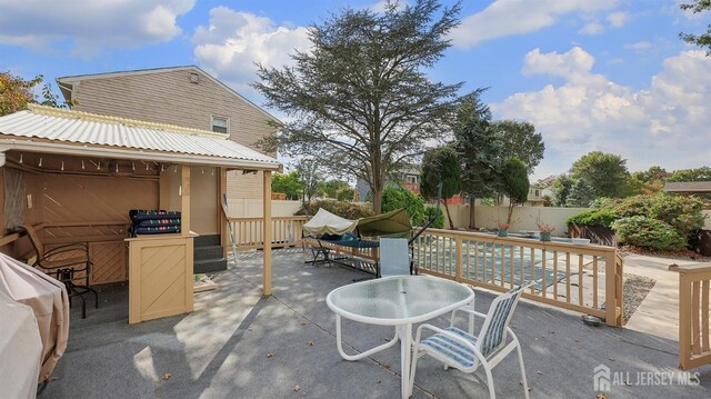 view of patio / terrace featuring outdoor dining space and a fenced backyard