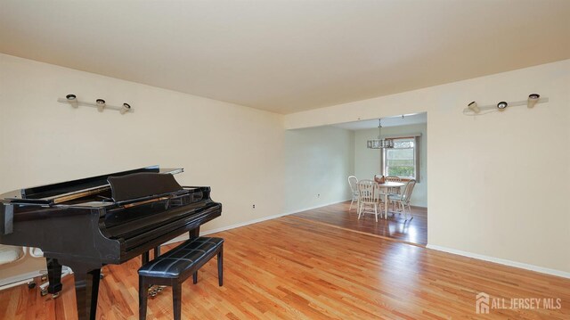 sitting room with light wood finished floors and baseboards