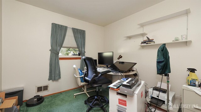 carpeted home office with visible vents and baseboards