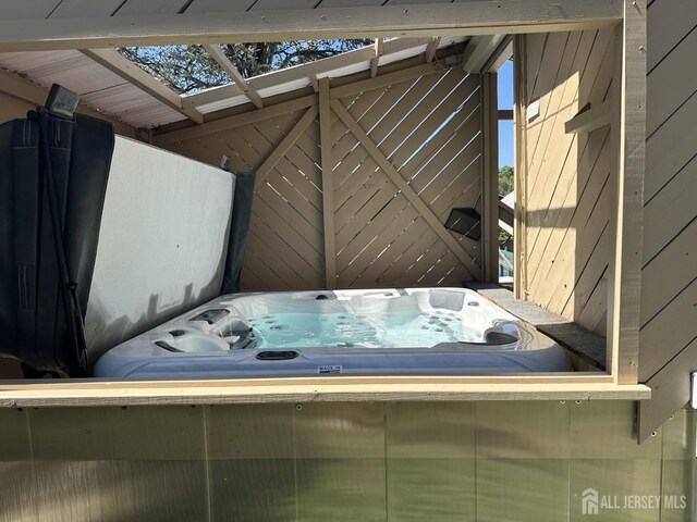 exterior space featuring a hot tub