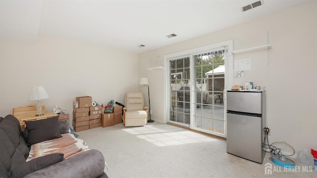 sitting room with light colored carpet