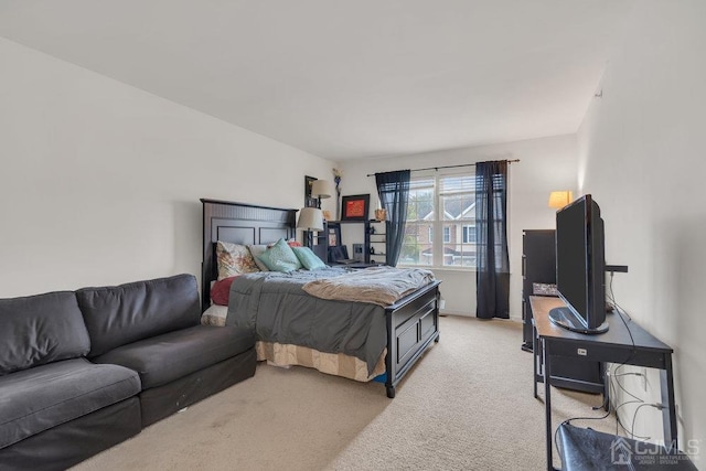 bedroom featuring light colored carpet