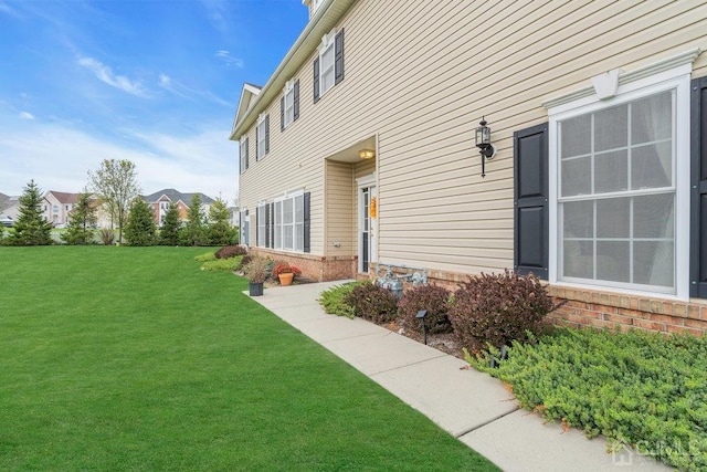 view of property exterior featuring a lawn