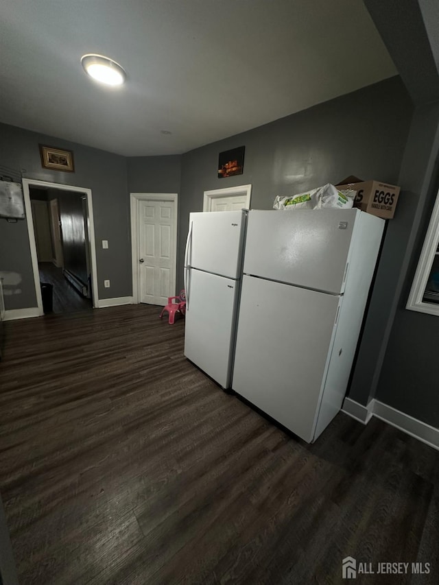 262 Hale St, New Brunswick, NJ 08901 - kitchen with dark wood finished floors, baseboards, and freestanding refrigerator