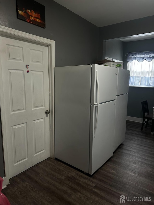 262 Hale St, New Brunswick, NJ 08901 - kitchen with baseboards, dark wood-type flooring, and freestanding refrigerator