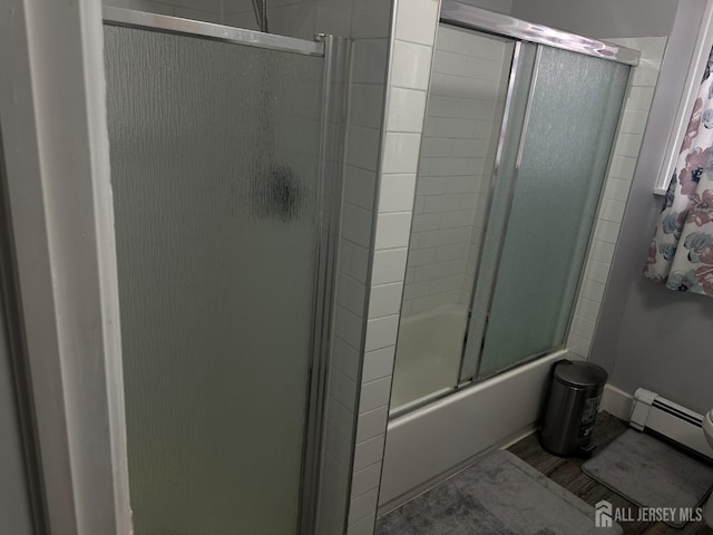 262 Hale St, New Brunswick, NJ 08901 - bathroom with baseboard heating and shower / bath combination with glass door