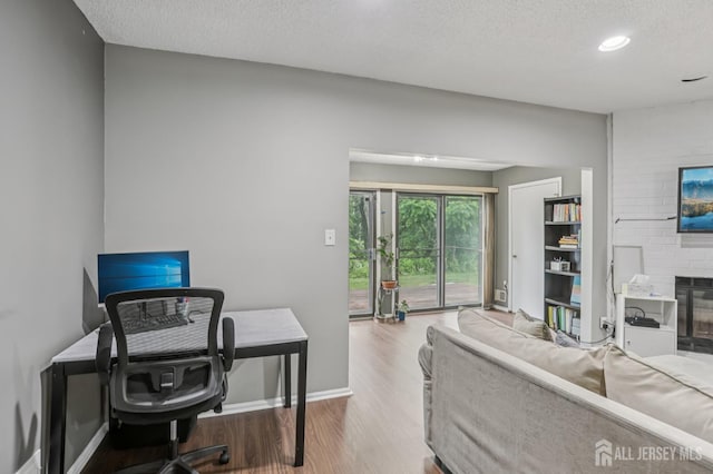 91 Pear Tree Ln, Franklin, NJ 08823 - home office featuring wood finished floors, a textured ceiling, and recessed lighting