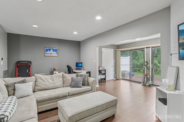 91 Pear Tree Ln, Franklin, NJ 08823 - living area with wood finished floors, recessed lighting, a desk, and a textured ceiling