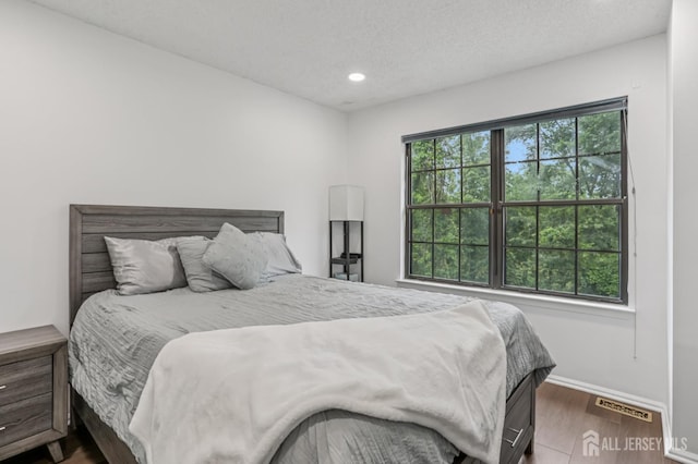 91 Pear Tree Ln, Franklin, NJ 08823 - bedroom featuring wood finished floors, recessed lighting, and a textured ceiling