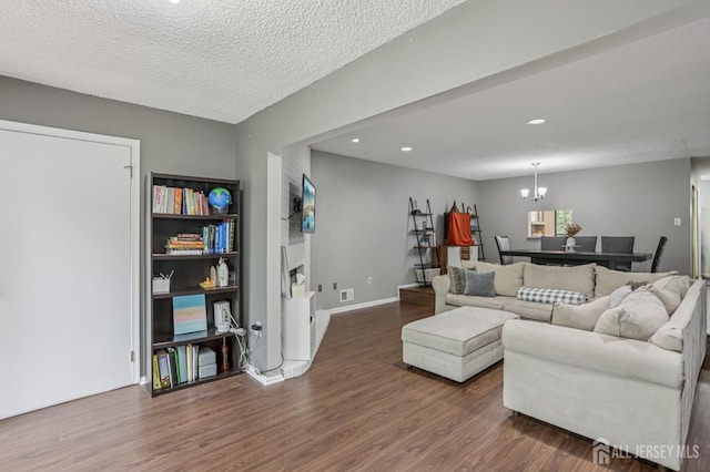 91 Pear Tree Ln, Franklin, NJ 08823 - living area featuring wood finished floors, a chandelier, recessed lighting, and a textured ceiling