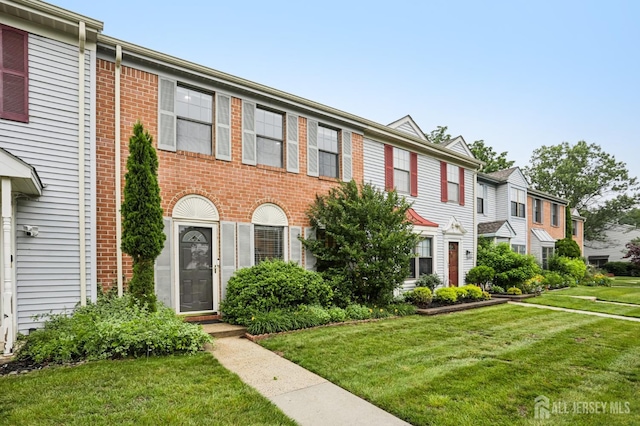 91 Pear Tree Ln, Franklin, NJ 08823 - multi unit property with a front lawn, brick siding, and a residential view