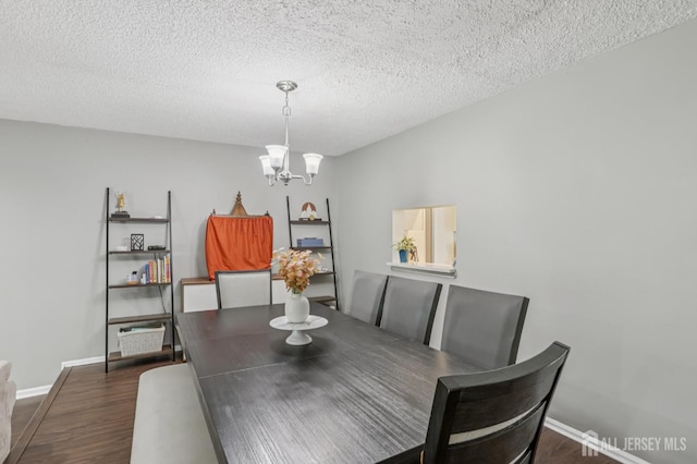 91 Pear Tree Ln, Franklin, NJ 08823 - dining space featuring dark wood-style flooring, a chandelier, and a textured ceiling