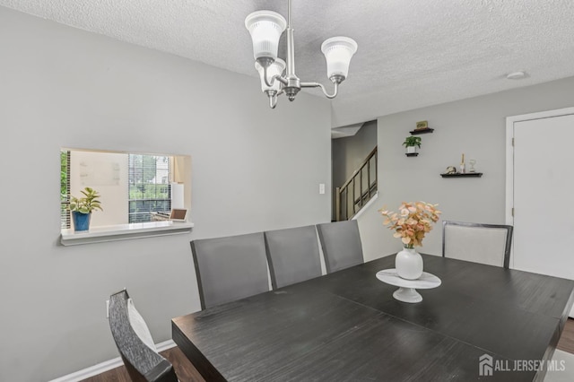 91 Pear Tree Ln, Franklin, NJ 08823 - dining space with stairway, a textured ceiling, a chandelier, and wood finished floors