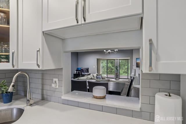 91 Pear Tree Ln, Franklin, NJ 08823 - kitchen with light countertops, white cabinetry, and tasteful backsplash
