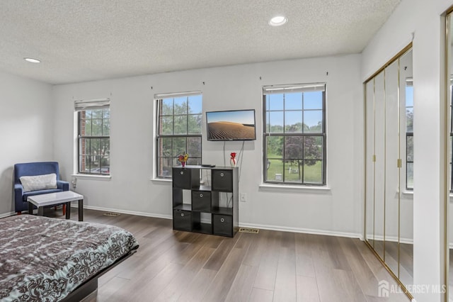 91 Pear Tree Ln, Franklin, NJ 08823 - bedroom with a textured ceiling, wood finished floors, and recessed lighting
