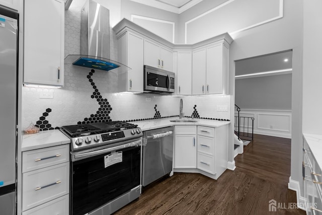 4 Arden Rd, Old Bridge, NJ 08857 - kitchen with ventilation hood, stainless steel appliances, a sink, dark wood-type flooring, and crown molding