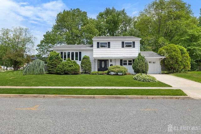 4 Arden Rd, Old Bridge, NJ 08857 - split level home with a front yard, an attached garage, and driveway
