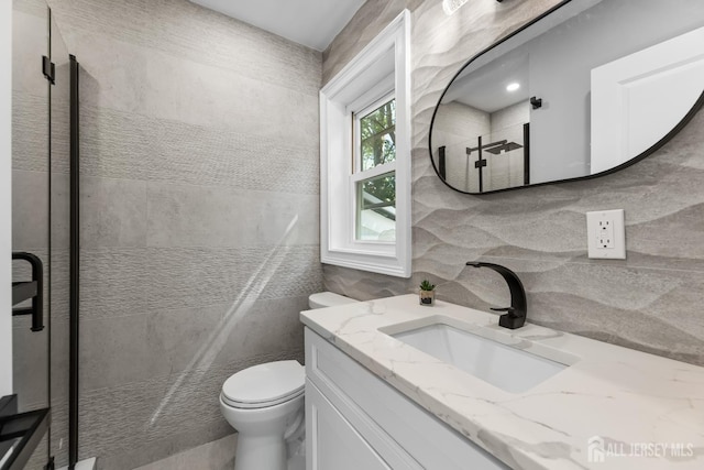 4 Arden Rd, Old Bridge, NJ 08857 - full bathroom with toilet, vanity, tile walls, tiled shower, and tasteful backsplash