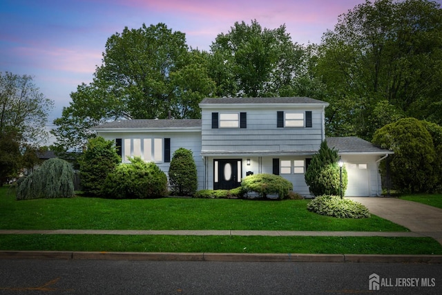 4 Arden Rd, Old Bridge, NJ 08857 - split level home with driveway, a front lawn, an attached garage, and a shingled roof