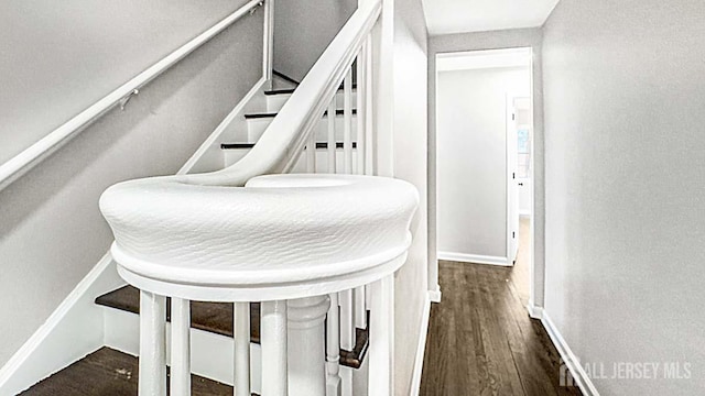 interior space featuring wood finished floors and baseboards