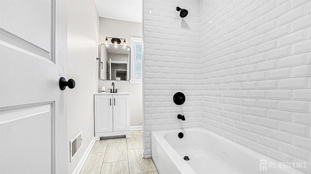 full bathroom with shower / bath combination, vanity, and baseboards