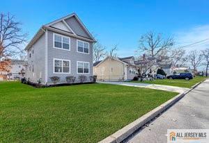 view of side of home featuring a yard