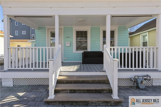 doorway to property with covered porch