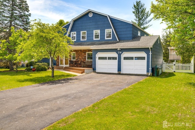 24 Christopher Ave, South Brunswick, NJ 08824 - colonial inspired home with asphalt driveway, a gambrel roof, a porch, and a garage