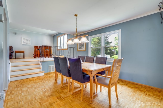 24 Christopher Ave, South Brunswick, NJ 08824 - dining area with baseboards, a chandelier, crown molding, and recessed lighting