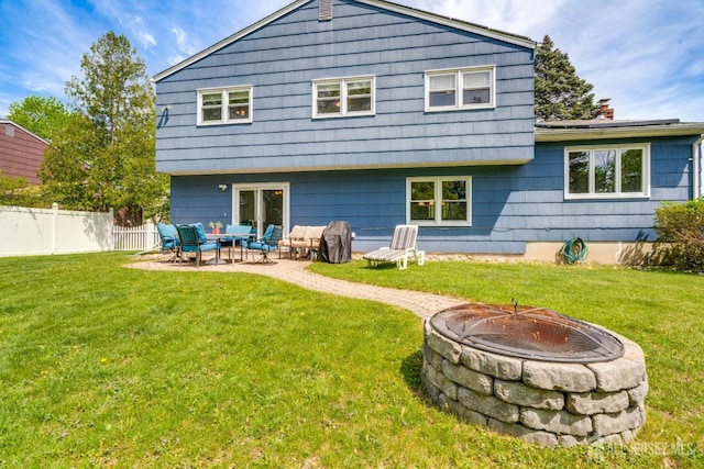 24 Christopher Ave, South Brunswick, NJ 08824 - rear view of house featuring a patio and an outdoor living space with a fire pit