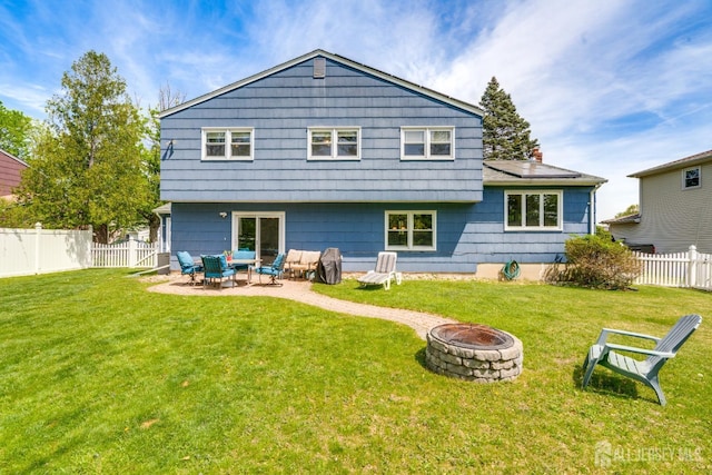 24 Christopher Ave, South Brunswick, NJ 08824 - back of house with a fire pit and a patio area