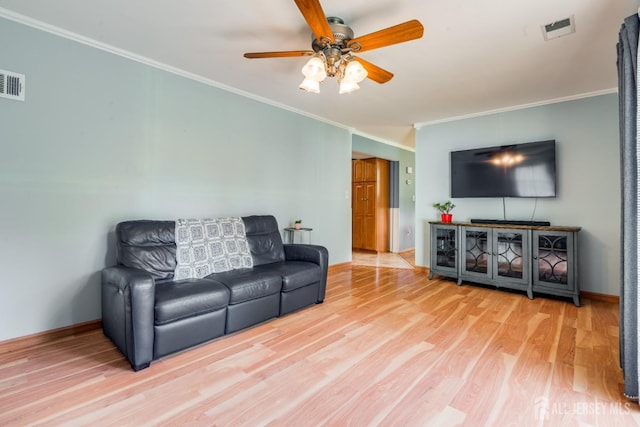 24 Christopher Ave, South Brunswick, NJ 08824 - living room featuring ornamental molding, a ceiling fan, wood finished floors, and baseboards
