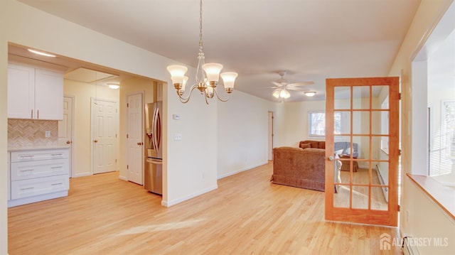 3 Cypress St Unit C, Toms River, NJ 08757 - dining space featuring light wood-type flooring, a ceiling fan, and a chandelier