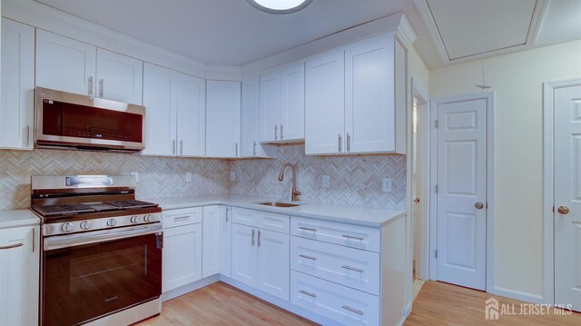 3 Cypress St Unit C, Toms River, NJ 08757 - kitchen featuring appliances with stainless steel finishes, light countertops, and light wood-style flooring