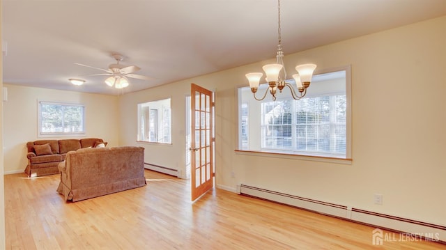 3 Cypress St Unit C, Toms River, NJ 08757 - living area featuring baseboard heating, a baseboard heating unit, light wood-type flooring, a chandelier, and a ceiling fan