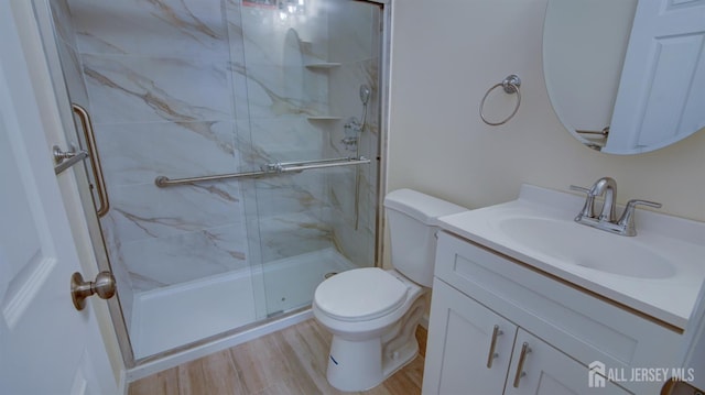 3 Cypress St Unit C, Toms River, NJ 08757 - full bathroom featuring vanity, a marble finish shower, and wood finished floors