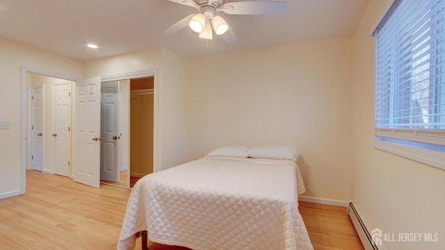 3 Cypress St Unit C, Toms River, NJ 08757 - bedroom with light wood-style floors, baseboard heating, ceiling fan, and a closet