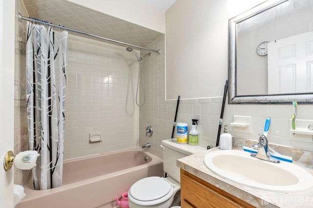 full bathroom featuring vanity, decorative backsplash, tile walls, toilet, and shower / bath combo