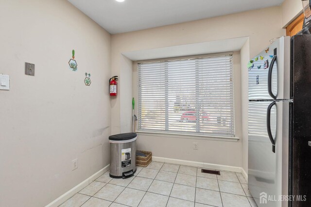 interior space featuring light tile patterned flooring