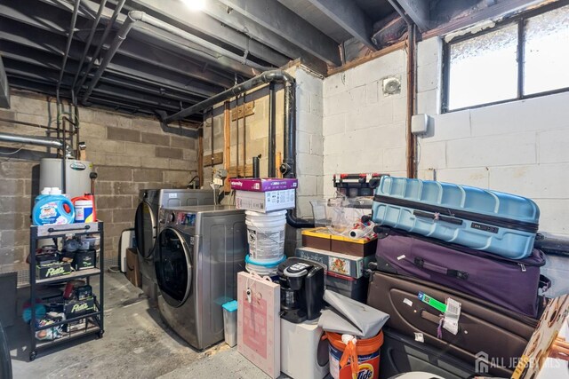 basement with gas water heater and washing machine and dryer