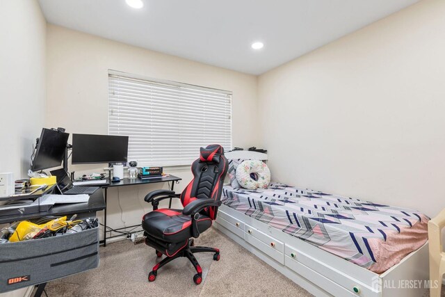 bedroom featuring light carpet