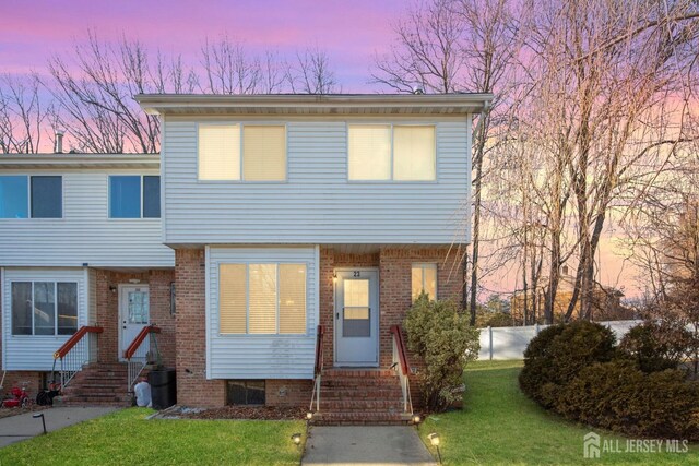 view of front of house with a yard