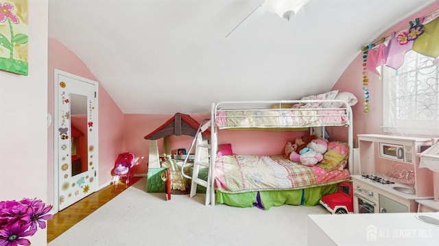 bedroom with lofted ceiling