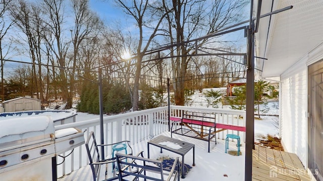 view of snow covered deck