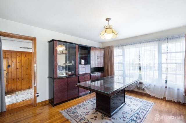 office area with light hardwood / wood-style floors