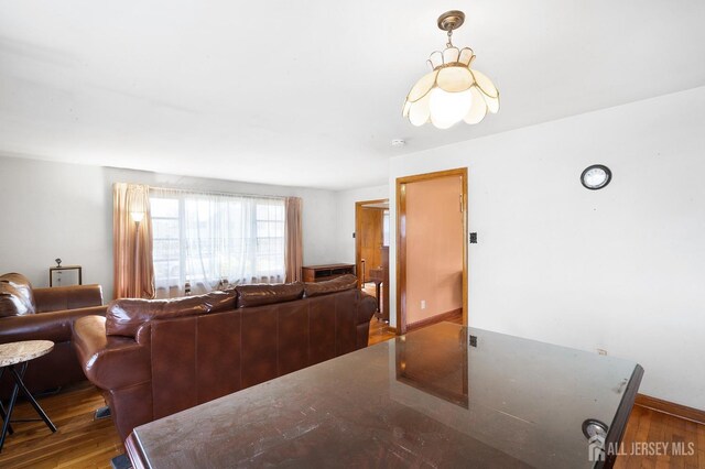 dining space with hardwood / wood-style floors