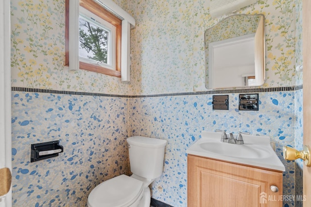 107 Athens Ave, Old Bridge, NJ 08879 - bathroom featuring toilet, wallpapered walls, and vanity