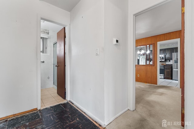 107 Athens Ave, Old Bridge, NJ 08879 - hallway with wood walls and tile patterned floors