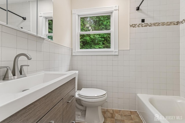 13 Spyros Dr, Old Bridge, NJ 08879 - bathroom featuring tile walls, vanity, bathtub / shower combination, and stone finish flooring
